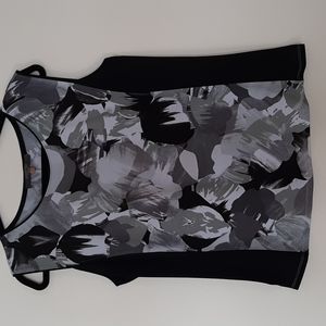Multi colored sleeveless top in graphic design.  Like New